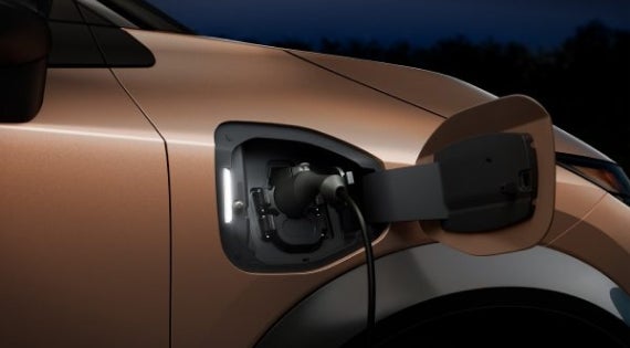 Close-up image of charging cable plugged in | Wood Nissan of Lee's Summit in Lee's Summit MO