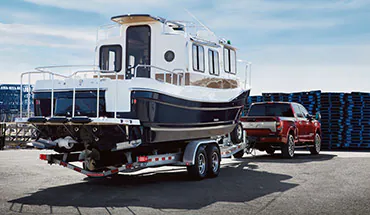2022 Nissan TITAN Truck towing boat | Wood Nissan of Lee's Summit in Lee's Summit MO